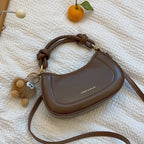 Doll-Decor Dumpling Shoulder Bag