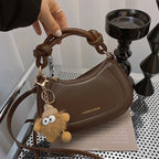 Doll-Decor Dumpling Shoulder Bag